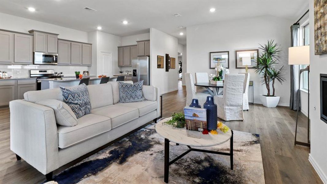 Living room featuring dark wood-type flooring and recessed lighting