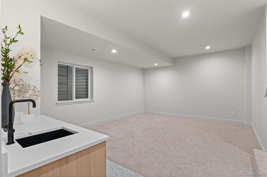 Basement wet bar with wine fridge