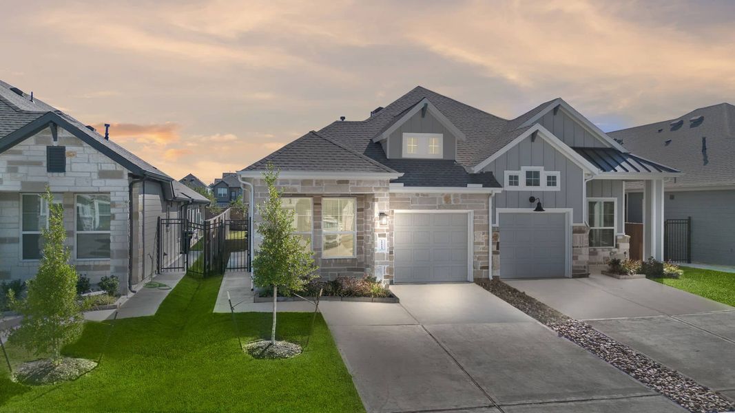 Front exterior of a new home in Meridiana, Iowa Colony, TX, highlighting curb appeal (Image 2).
