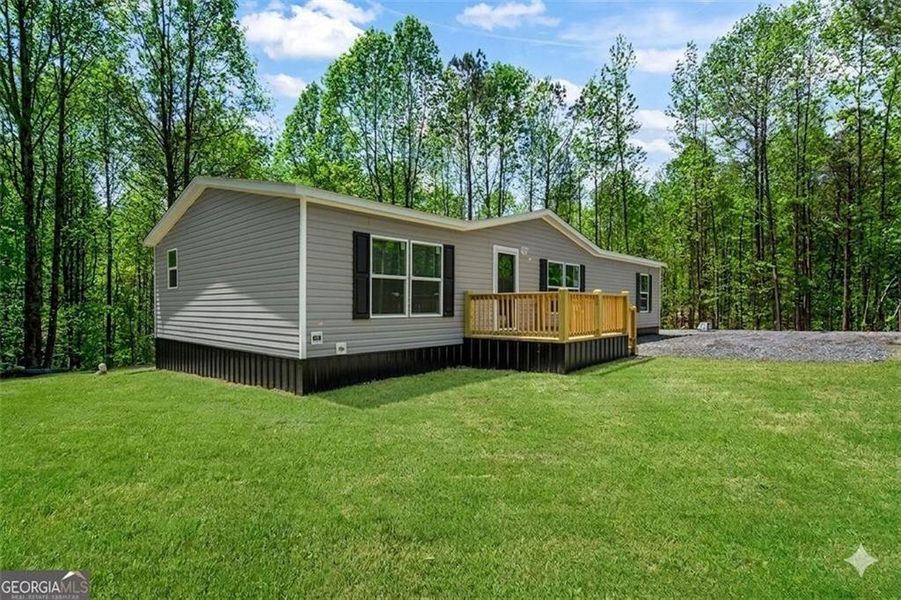 Exterior details and patio area of a home in , Ellijay (Image 25).