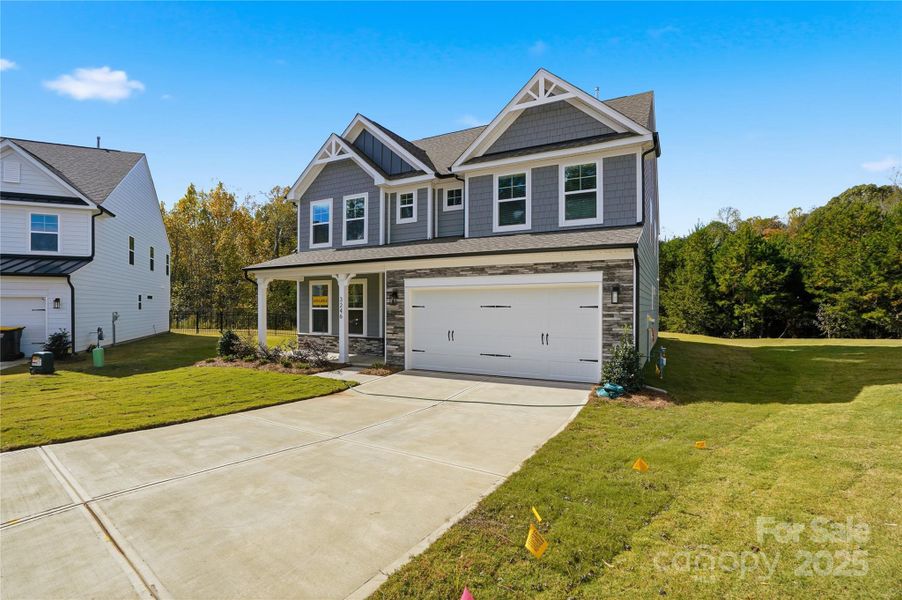 Front exterior of a new home in Carrington, Stanley, NC, highlighting curb appeal (Image 2). Front exterior of a new home in Carrington, Stanley, NC, highlighting curb appeal (Image 2).