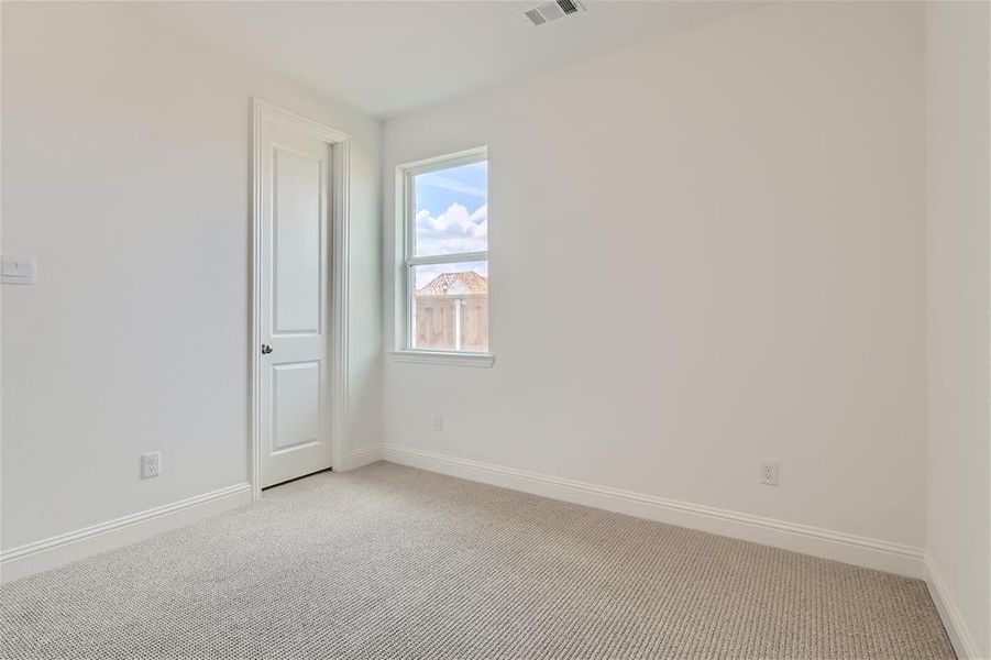 Unfurnished room featuring carpet