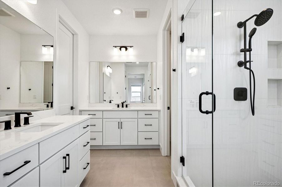 Primary bath; QUARTZ counters; walk-in shower; two vanity options Primary bath; QUARTZ counters; walk-in shower; two vanity options