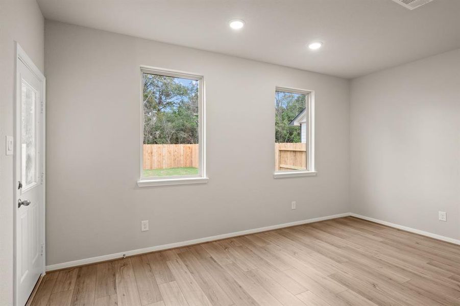 With an abundance of natural light streaming through the windows, the breakfast nook is bathed in a sunny glow, creating the perfect atmosphere to enjoy your morning coffee or a family breakfast.