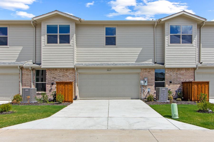 Front exterior of a new home in Cottonwood Creek, Rowlett, TX, highlighting curb appeal (Image 25).