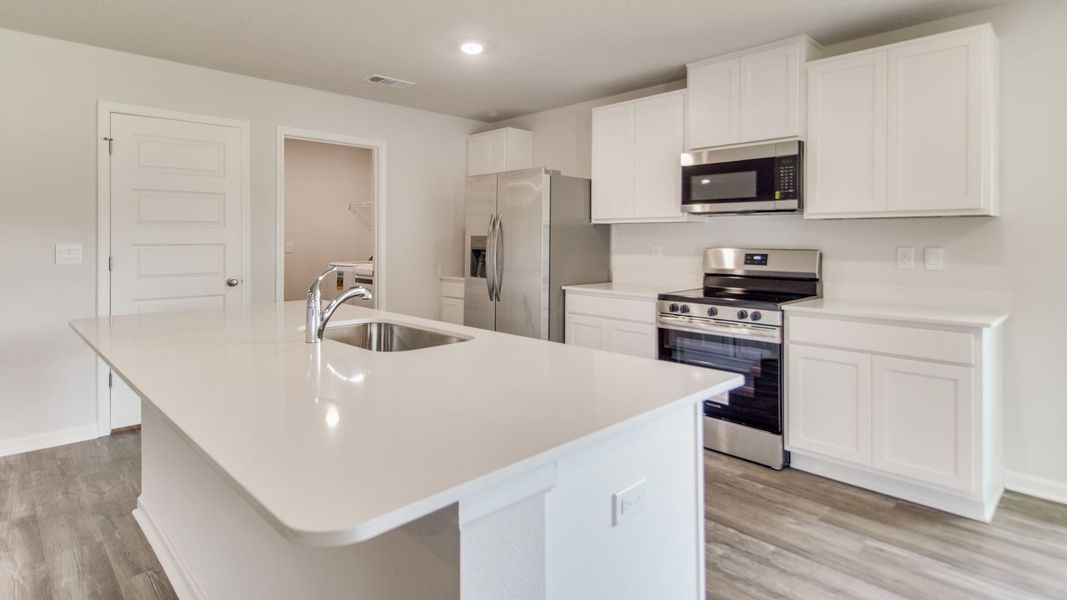 Furnished interior view inside a new home in The Enclave at Bar W Ranch, Baker (Image 6).