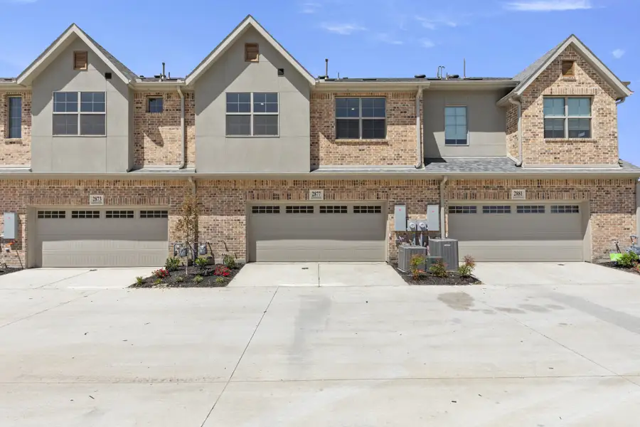 Front exterior of a new home in The Tribute, The Colony, TX, highlighting curb appeal (Image 2). Front exterior of a new home in The Tribute, The Colony, TX, highlighting curb appeal (Image 2).