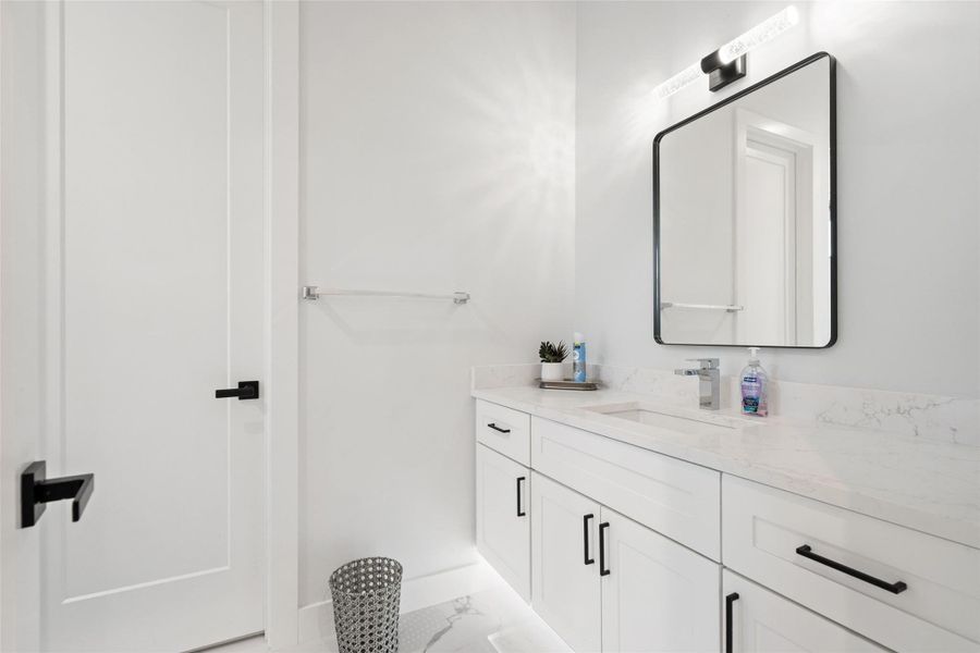 . Three additional ensuite bedrooms provide generous accommodations for family and guests alike.