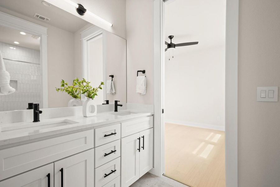 Full bathroom with double vanity, ceiling fan, and recessed lighting