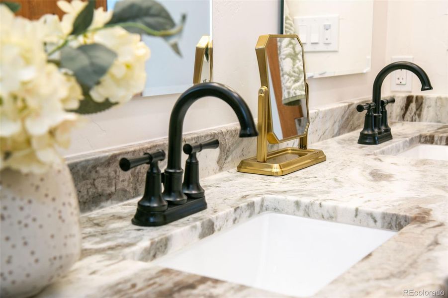 3rd full bathroom floor to ceiling tile with Fantasy Brown Satin marble, 2 sinks, and a shower/tub combo.