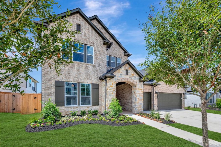 Front exterior of a new home in Jordan Ranch - Premier Collection, Fulshear, TX, highlighting curb appeal (Image 22).