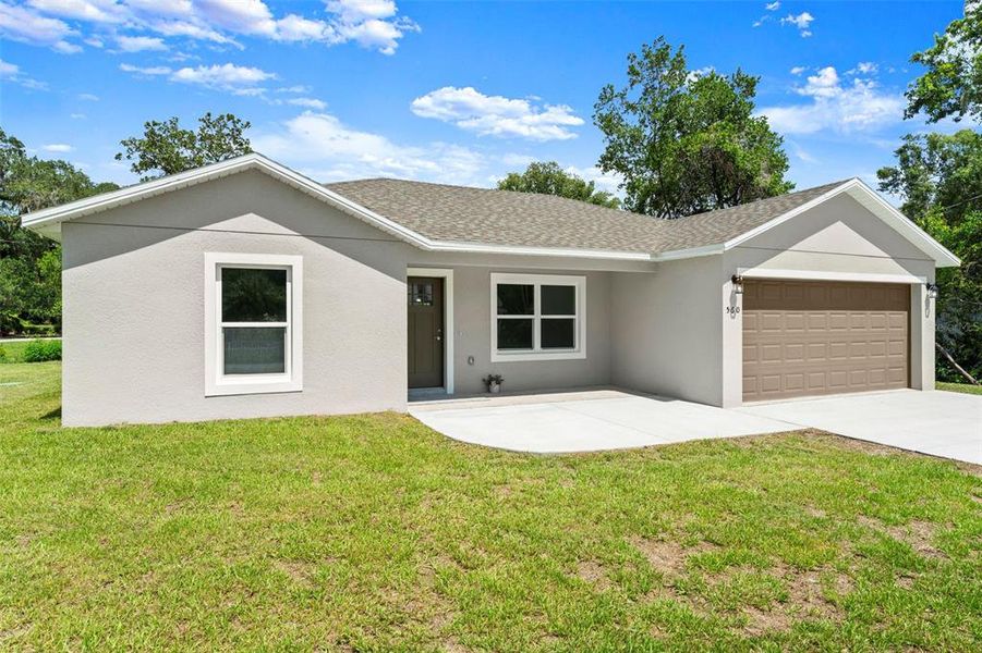 Front exterior of a new home in , Orange City, FL, highlighting curb appeal (Image 27).