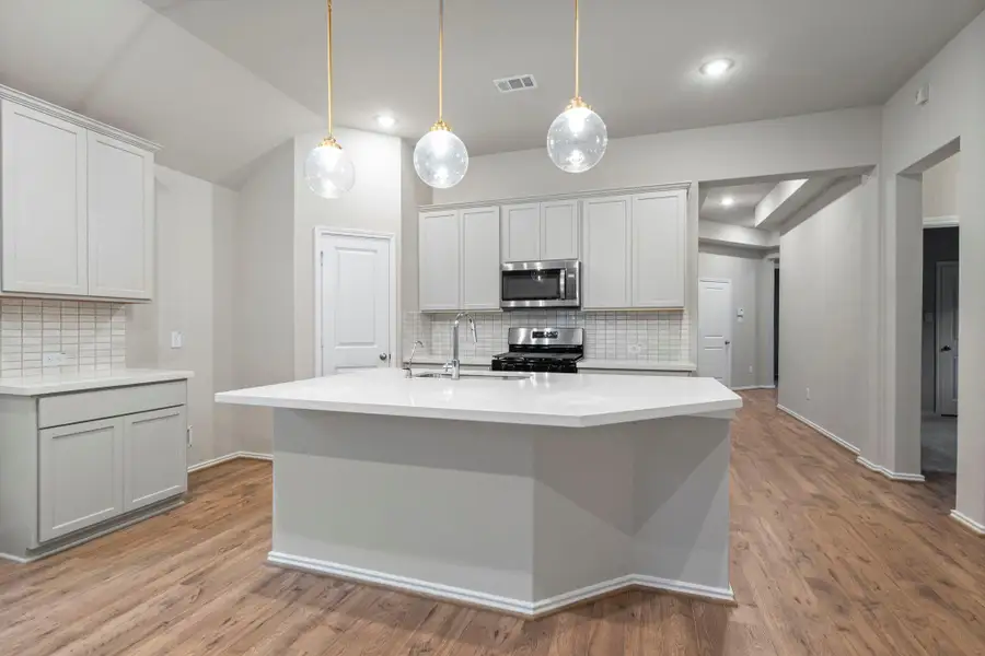 Furnished interior view inside a new home in Bridgeland, Cypress (Image 6).