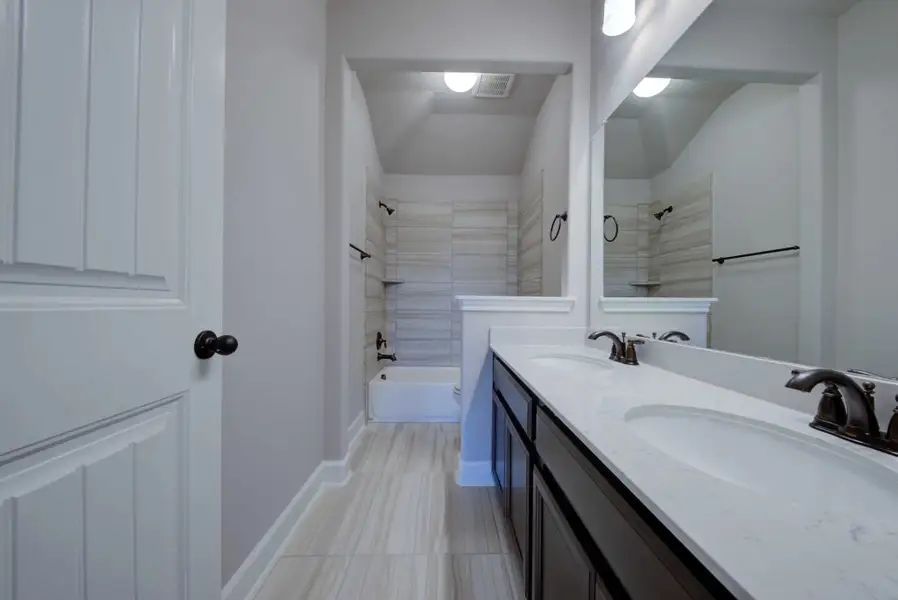 Representative furnished interior of a home built from the Barnett by Ashton Woods in Sunday Creek at Kinder Ranch, San Antonio (Image 11).