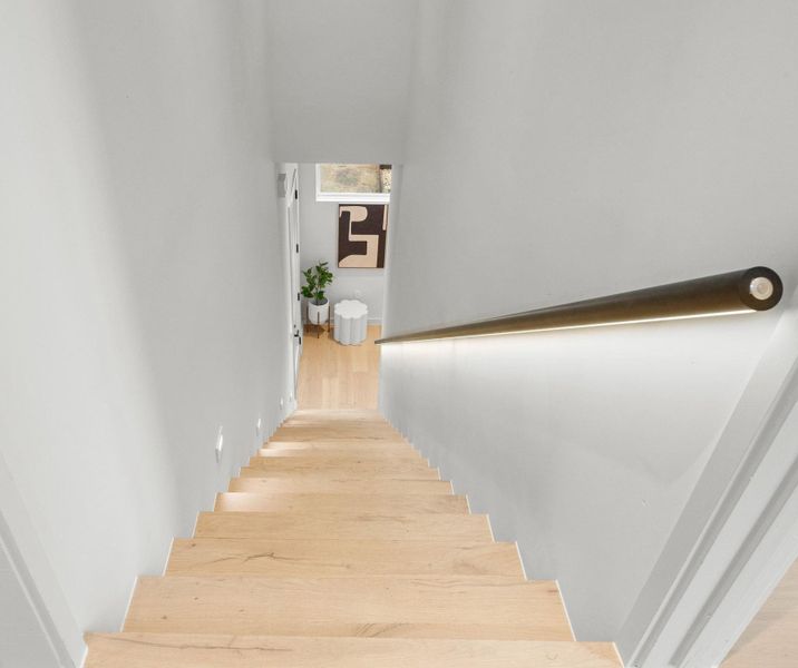 Check out the lighted stair rail!  It's got a motion sensor.