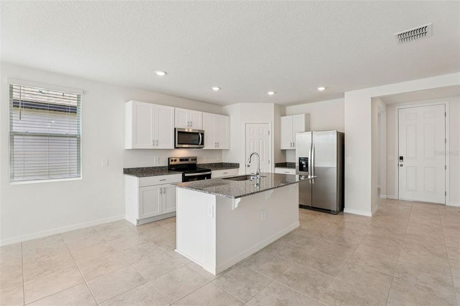 Furnished interior view inside a new home in Lawson Dunes - Signature Series, Haines City (Image 7).
