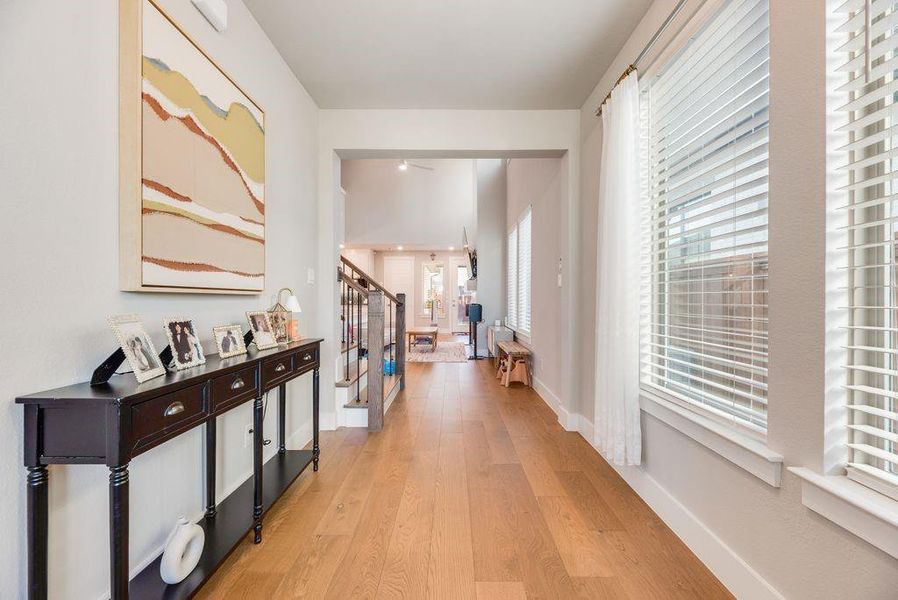 Hall with stairway and light wood finished floors