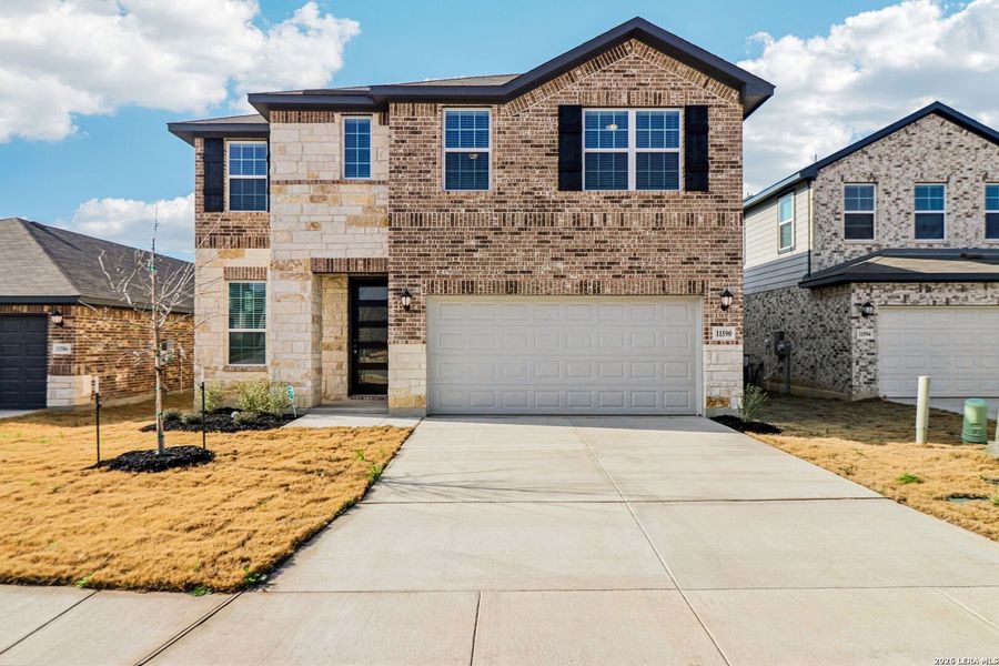 Front exterior of a new home in Sagebrooke - Premier Series, San Antonio, TX, highlighting curb appeal (Image 24).