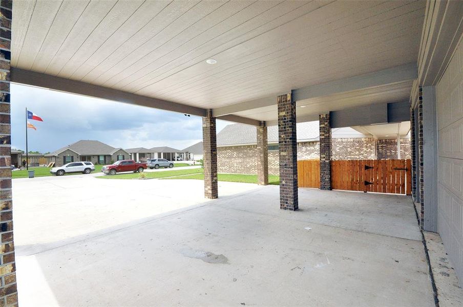 Protect the vehicles and the family form the elements with an easy walk into the kitchen under the breezeway.