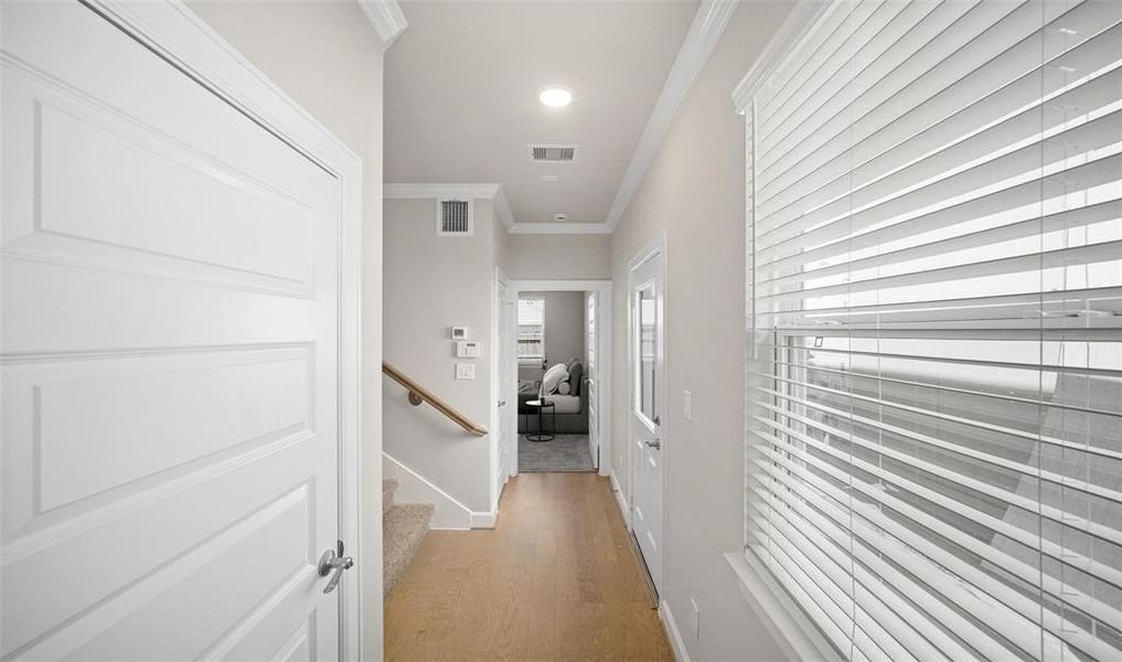 Upon entry, you will noticed recessed lighting, crown molding, engineered wood flooring, and modern doors. The home features natural lighting from the double paned windows.