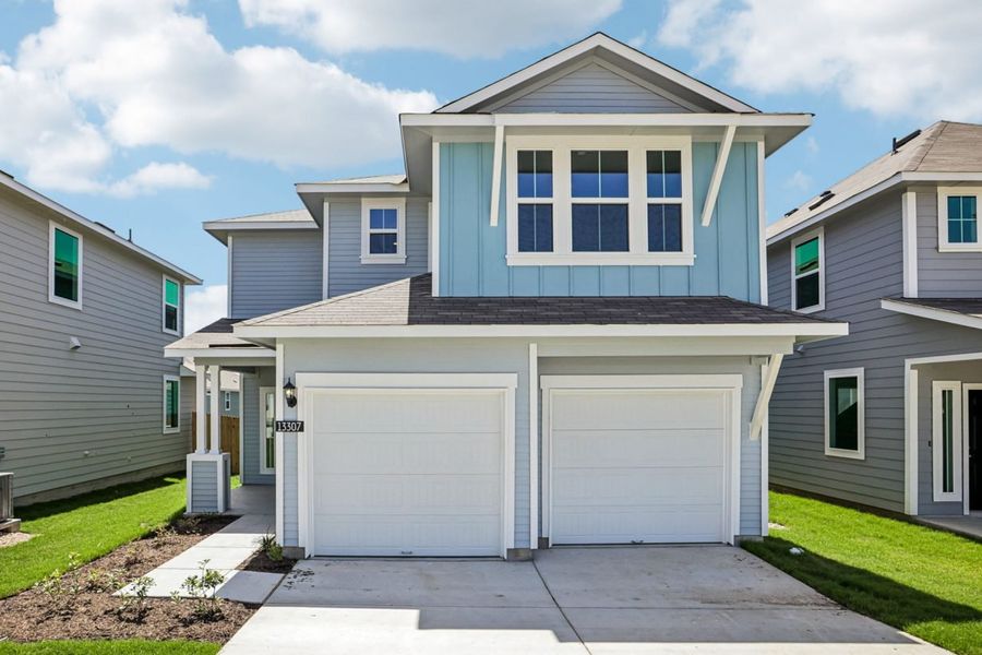 Front exterior of a new home in Edgebrooke, Pflugerville, TX, highlighting curb appeal (Image 1). Front exterior of a new home in Edgebrooke, Pflugerville, TX, highlighting curb appeal (Image 1).