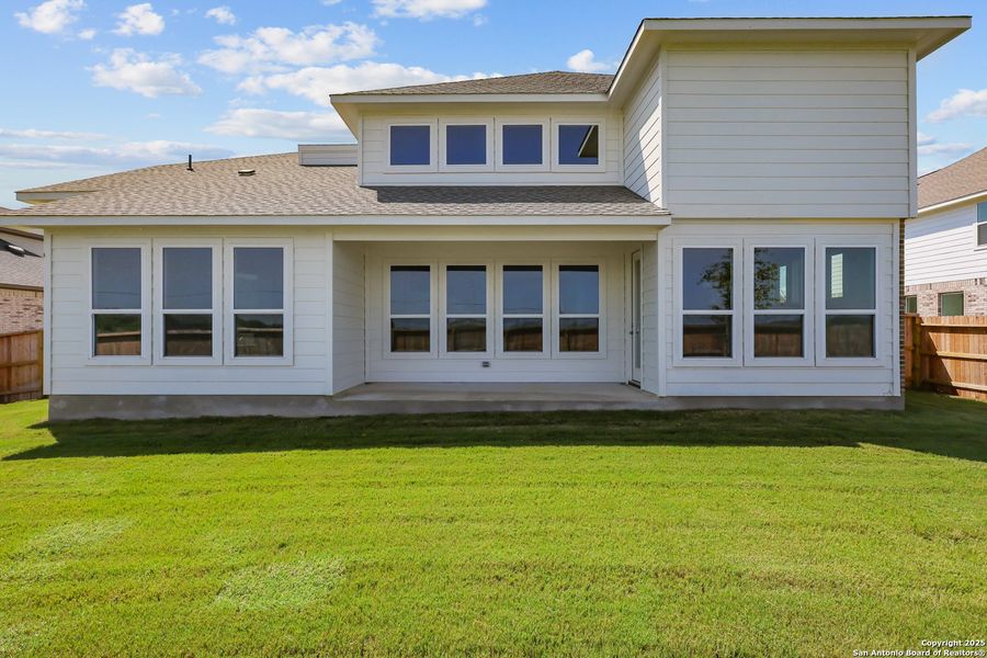 Front exterior of a new home in Megan's Landing 50', Castroville, TX, highlighting curb appeal (Image 17).