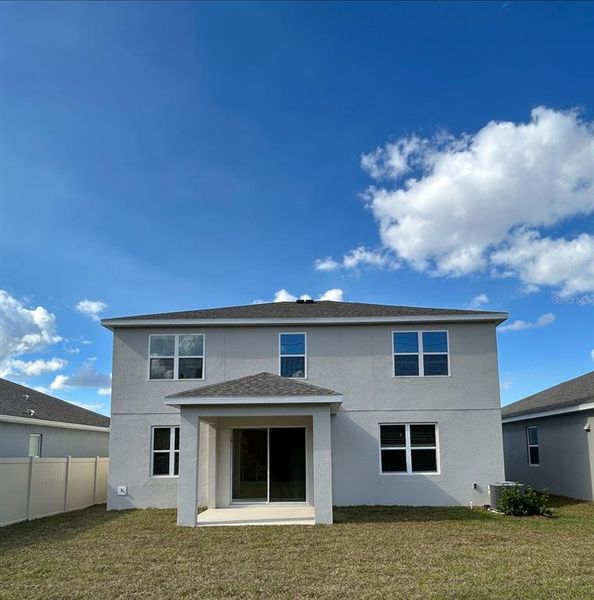 Exterior details and patio area of a home in Trinity Place, St. Cloud (Image 3).