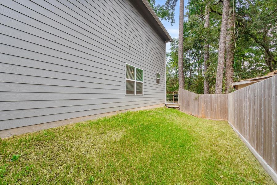 Exterior details and patio area of a home in , Conroe (Image 23).