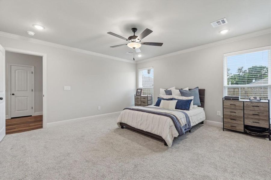 Spacious bedroom featuring a private ensuite bath for added comfort and convenience.