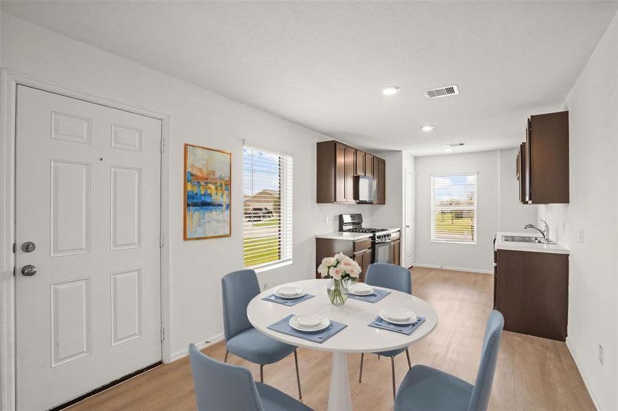 Start your day off right with a cup of coffee sitting with your family in the breakfast area! This kitchen conveniently connects to the breakfast area and living room for easy entertaining! *This photo has been virtually staged