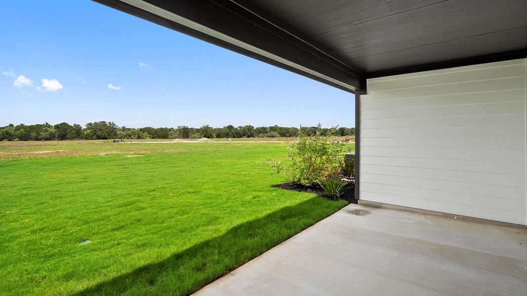 Exterior details and patio area of a home in Railhead, Cedar Creek (Image 3).