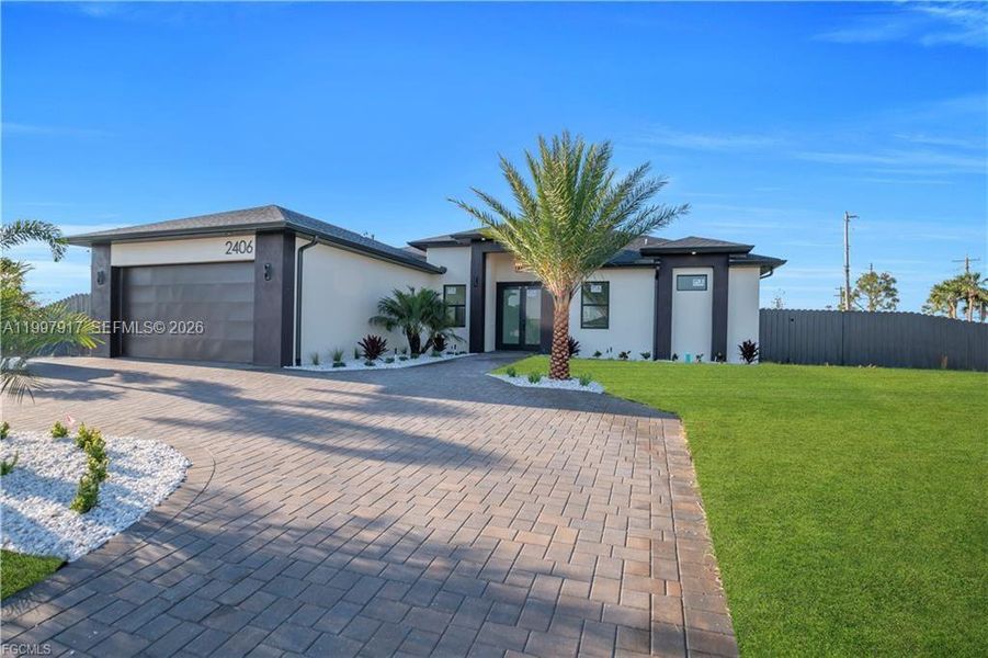 Front exterior of a new home in , Cape Coral, FL, highlighting curb appeal (Image 19). Front exterior of a new home in , Cape Coral, FL, highlighting curb appeal (Image 19).