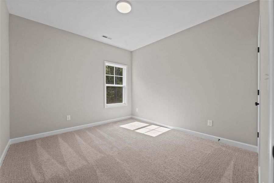 Representative unfurnished interior of a home built from the Weymouth by Caviness & Cates Communities in Bartlett Manor, Youngsville (Image 67).