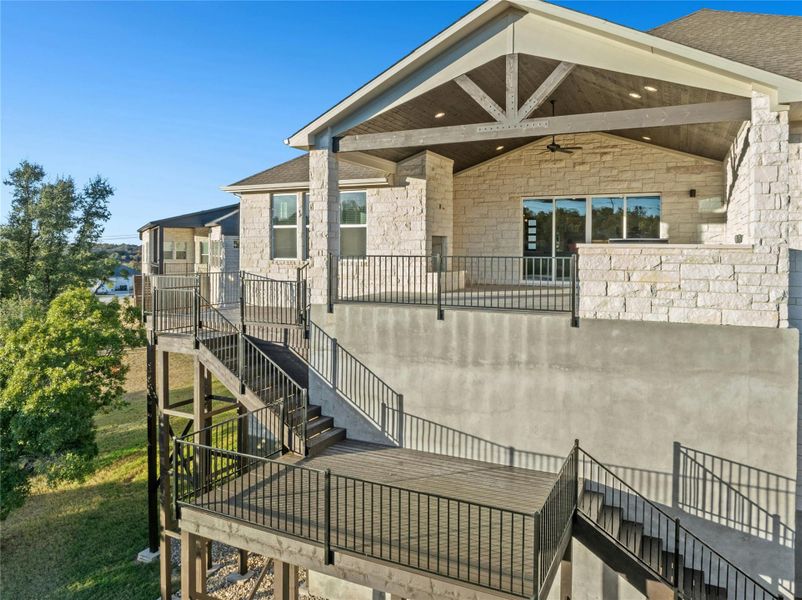 Doorway to property with stone siding and a patio Doorway to property with stone siding and a patio