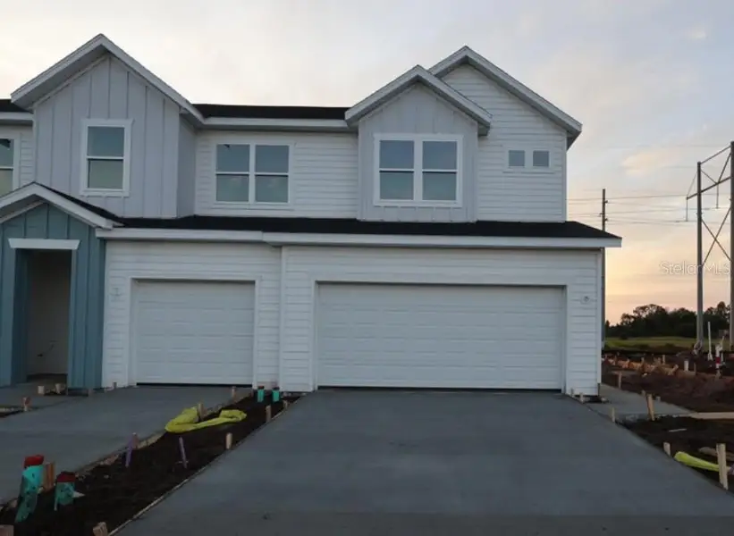 Front exterior of a new home in , Apollo Beach, FL, highlighting curb appeal (Image 2). Front exterior of a new home in , Apollo Beach, FL, highlighting curb appeal (Image 2).