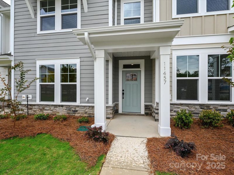 Front exterior of a new home in North Creek Village - Townhomes, Huntersville, NC, highlighting curb appeal (Image 18).