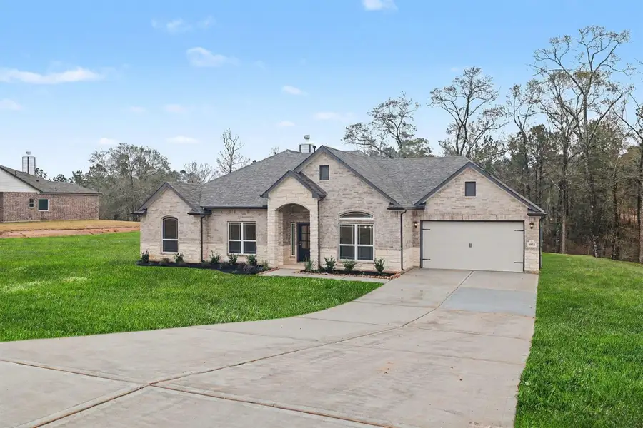 Front exterior of a new home in Rose Hill Estates, Willis, TX, highlighting curb appeal (Image 20).