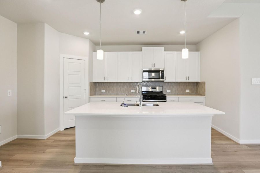 Photos are not of the actual home, but are photos of the builder home with same floorplan with similar interior finishes.