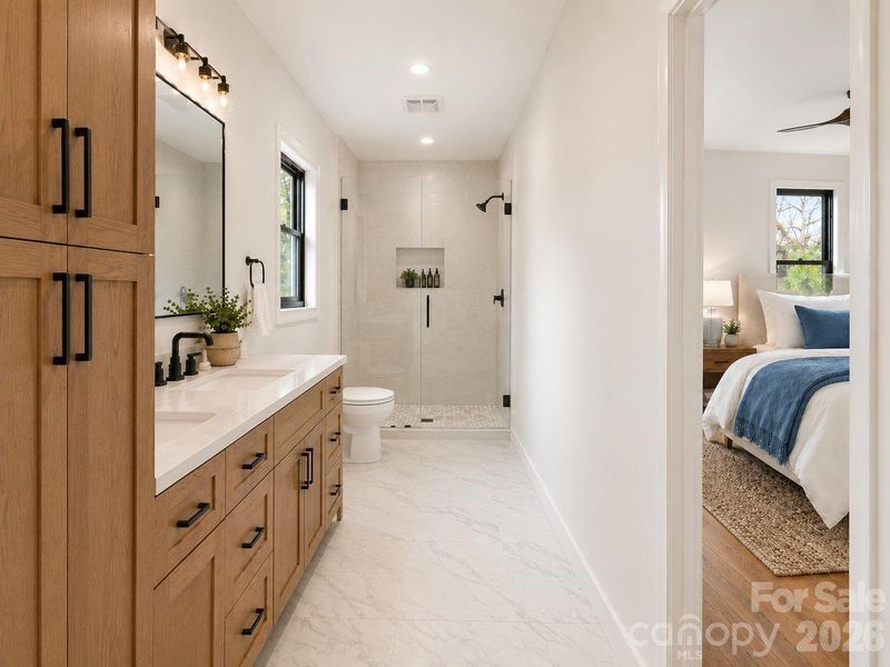 Primary bathroom with walk in shower and bench seating. Primary bathroom with walk in shower and bench seating.