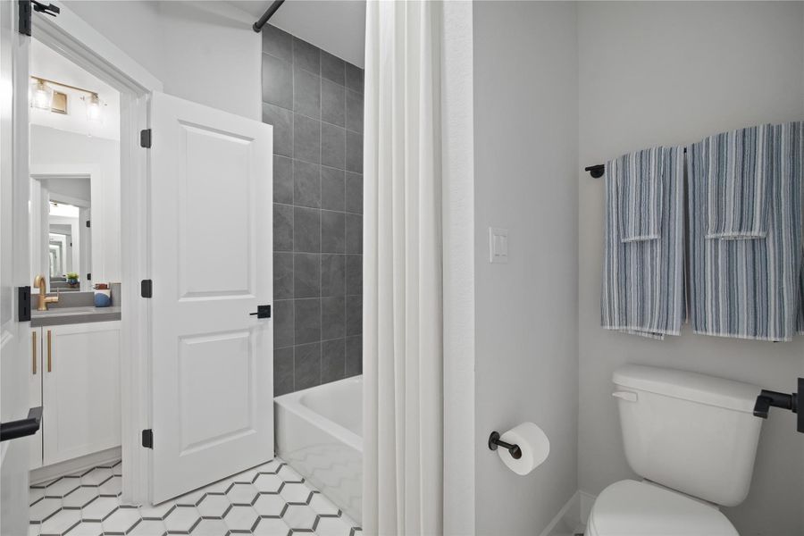 Full bathroom featuring vanity and shower / washtub combination