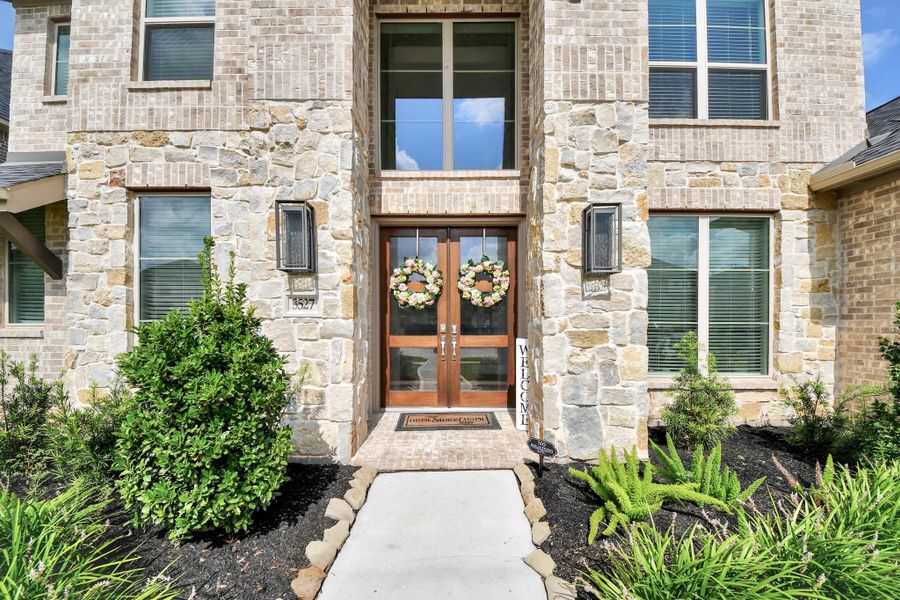 Exterior details and patio area of a home in Legacy Prairie at Katy Court, Katy (Image 27).