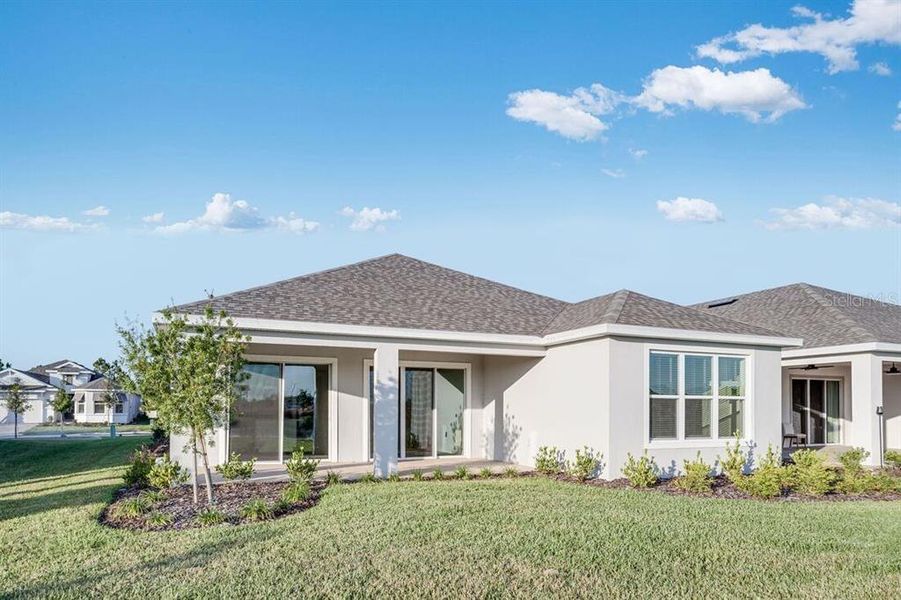 Front exterior of a new home in Esplanade at Center Lake Ranch, St. Cloud, FL, highlighting curb appeal (Image 2).