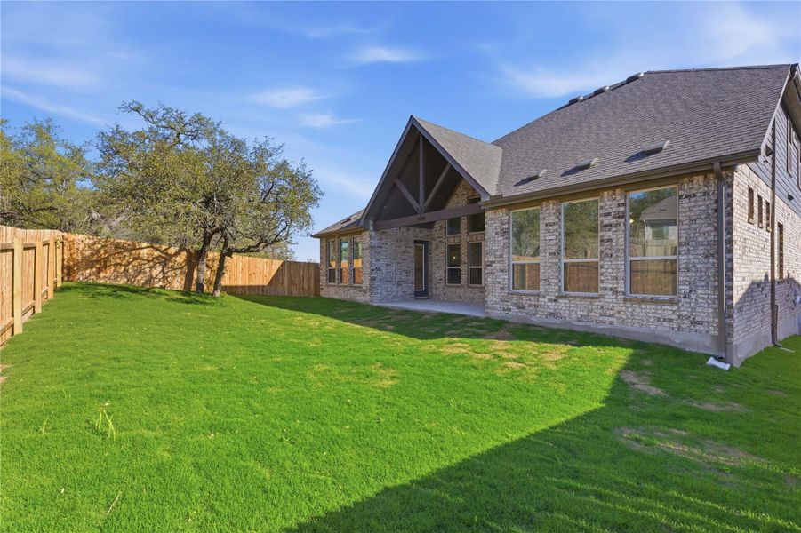 Exterior details and patio area of a home in Retreat at San Gabriel, Georgetown (Image 4).