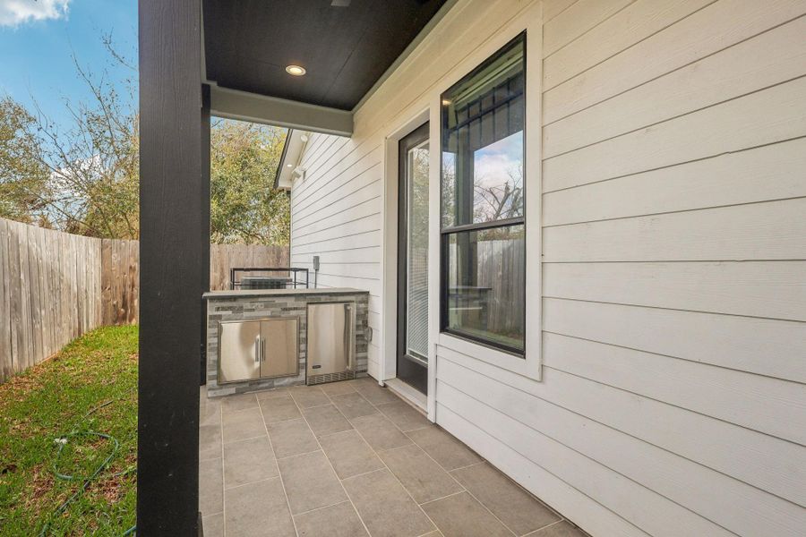 Exterior details and patio area of a home in , Houston (Image 1).