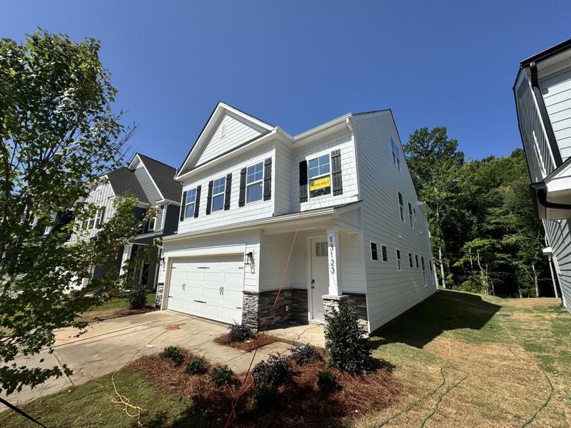 Front exterior of a new home in Caldwell Forest, Charlotte, NC, highlighting curb appeal (Image 2). Front exterior of a new home in Caldwell Forest, Charlotte, NC, highlighting curb appeal (Image 2).