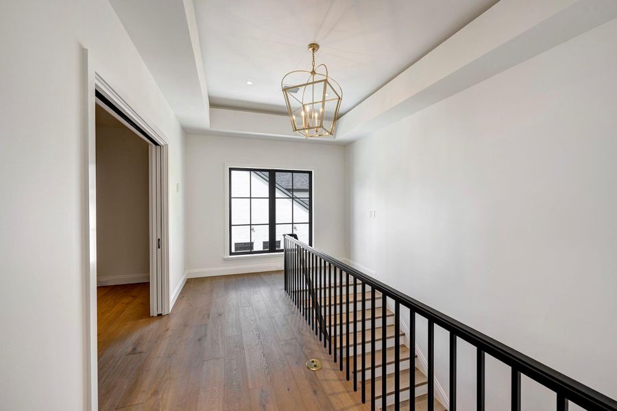 Upstairs landing is light filled.  Pocket doors on the left open to flex space which can be used for craft room, storage or office.