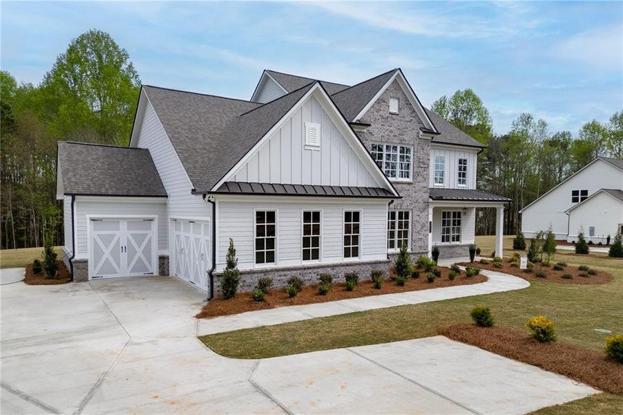 Front exterior of a new home in , Cumming, GA, highlighting curb appeal (Image 28).