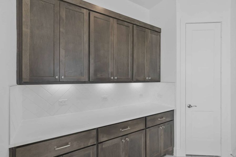 Representative furnished interior of a home built from the Nicklaus by Chesmar Homes in Riceland Alley Loads, Mont Belvieu (Image 41).