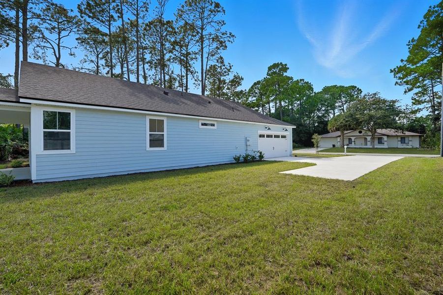 Exterior details and patio area of a home in Palm Coast Homes, Palm Coast (Image 24).