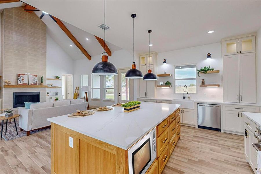 Virtural Microwave Kitchen with beamed ceiling, a kitchen island, sink, white microwave, and stainless steel dishwasher